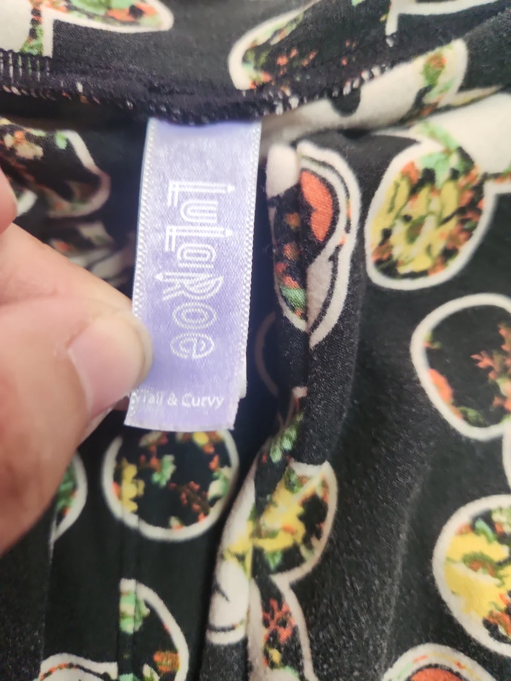 LuLaRoe Black Skinny Jeans with Cream Character Faces
